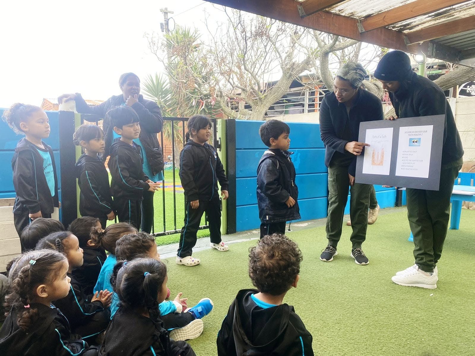 A teacher leading a learning moment at Wonderland Kids' Academy